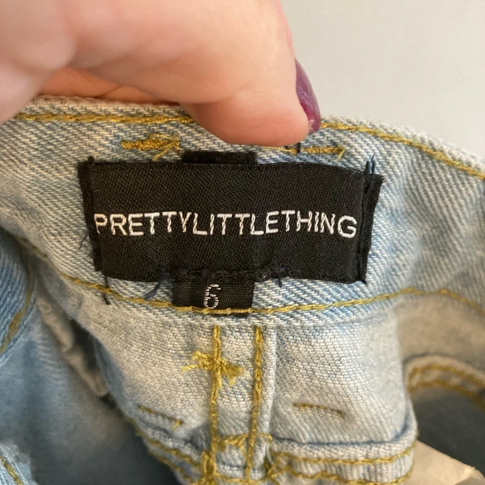 PrettyLittleThing Chain Detail Denim Mini Skirt with raw hem US Size 2